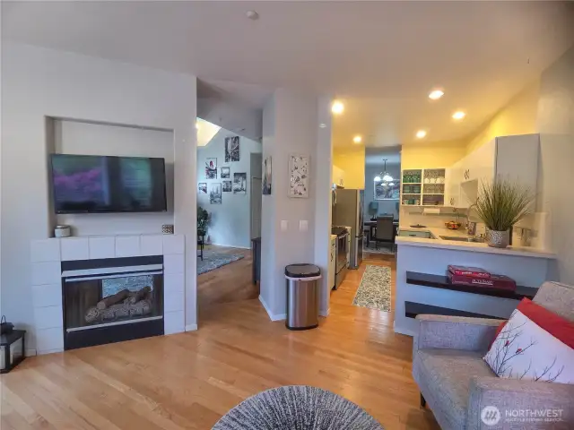 Looking from the flex room into the kitchen and dining room, and the door to the living room.