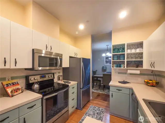The pass-thru kitchen has Stainless appliances and lots of cabinet space.