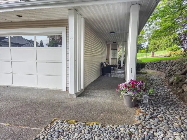 This is a corner end unit with a lovely private covered porch.