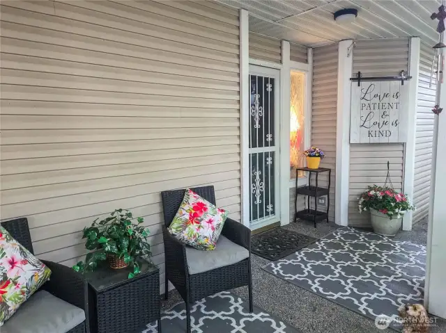 The covered porch leads to the front door, with lots of room for your personal decor, room for relaxing and conversation.