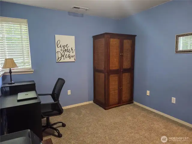 Another view of bedroom #3 with corner windows. This bedroom door is very close to the main hall bathroom as well for quick and easy access.