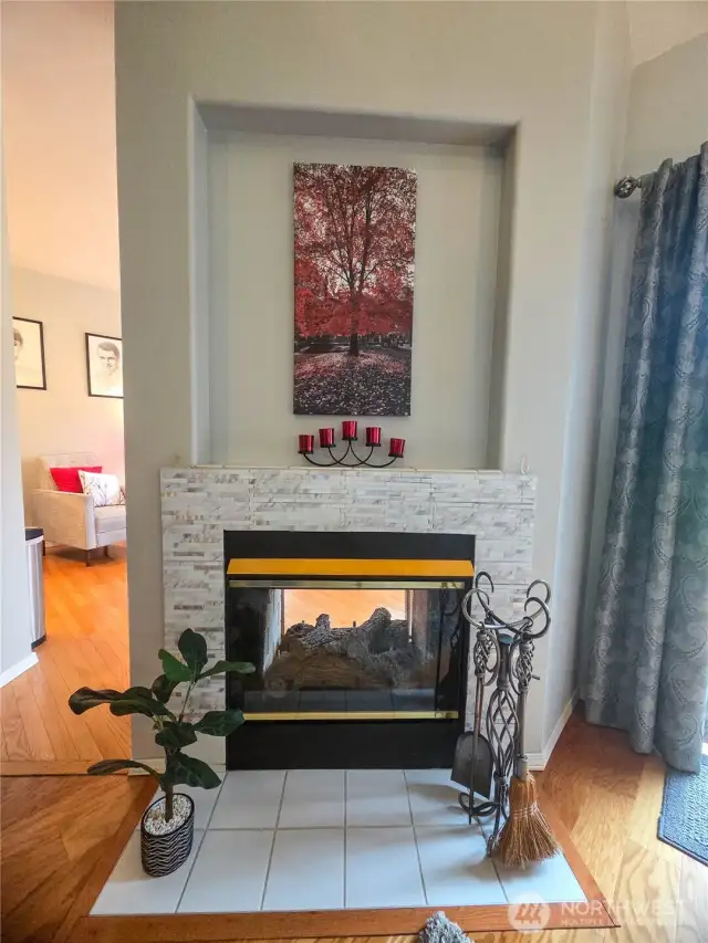 Looking at the two-way gas fireplace from the living room.