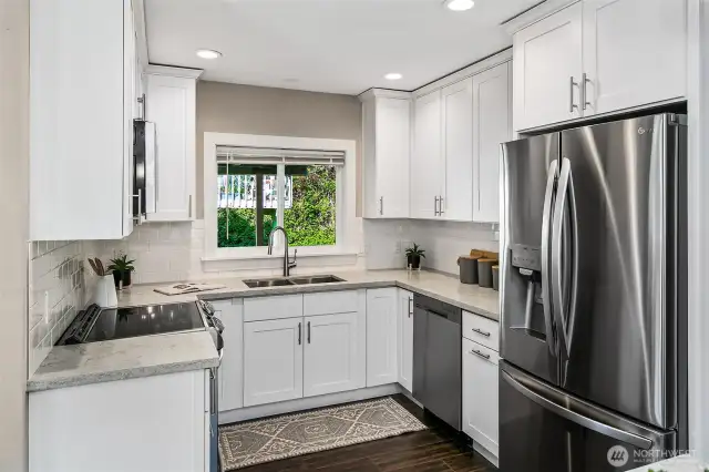 Kitchen is open and has a nice island. Dining room has access to a covered porch. All remodeled in 2018.