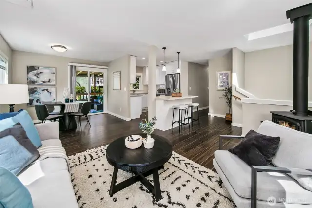 Open living space; great light- newer finishes, plus access to a covered deck. Notice the cozy gas fireplace and A/C.