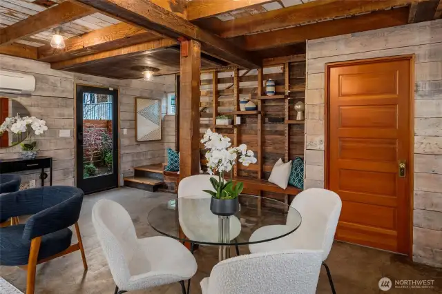 Two bedrooms are located on the upper level, which is accessed by an artfully constructed stairway.
