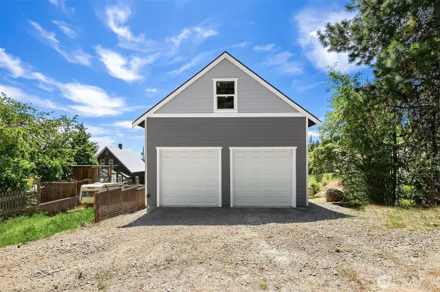 Detached garage/shop perfect for all your toys and space upstairs already wired with mini splits and ready to build another apartment or use as the ideal home office space!