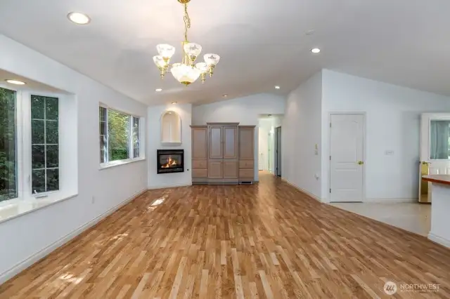 View from dining area over great room with cozy propane fireplace built in.