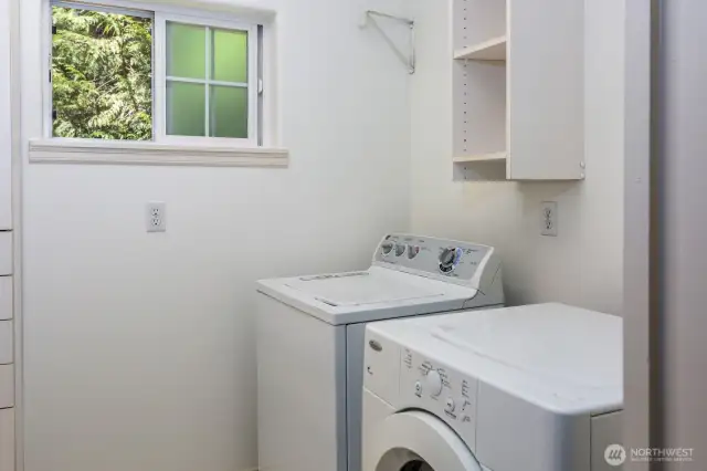 Laundry room is also adjacent to primary bedroom for convenience.