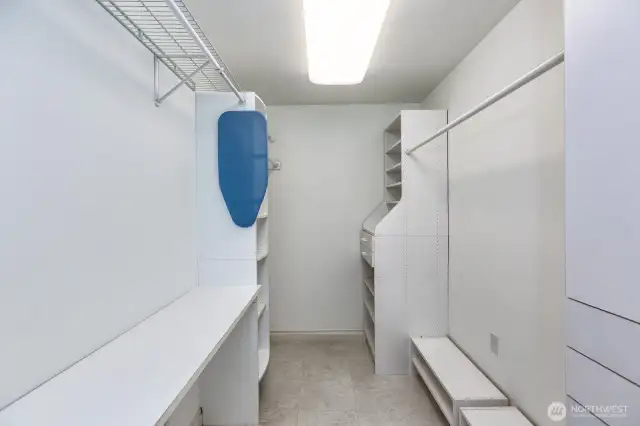 Large laundry room and closet off primary bedroom.
