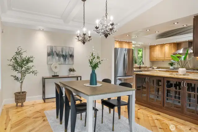Dining room features two beautiful chandeliers, extra lighting, vaulted ceilings and plenty of room for a large table.