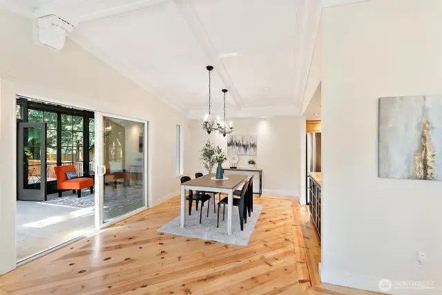 Dining room has slider to Sunroom which leads to deck.  Notice the details of the beautifully refinished floors.