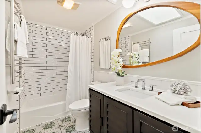 Beautifully updated primary bathroom! Don't miss the skylight that opens!