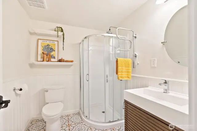 Updated three-quarter bathroom on lower level.