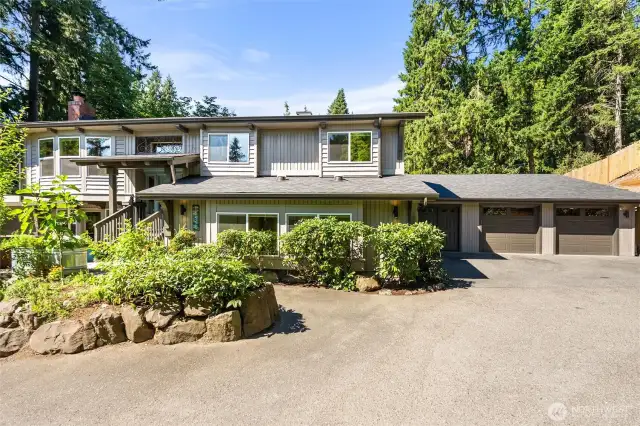 New roof with transferrable warranty.  Two-car garage with shop space or extra storage. Professionally landscaped spaces.  New fence!