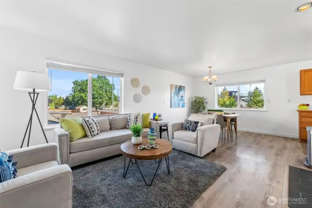 Open and spacious living and dining area with gas fireplace.