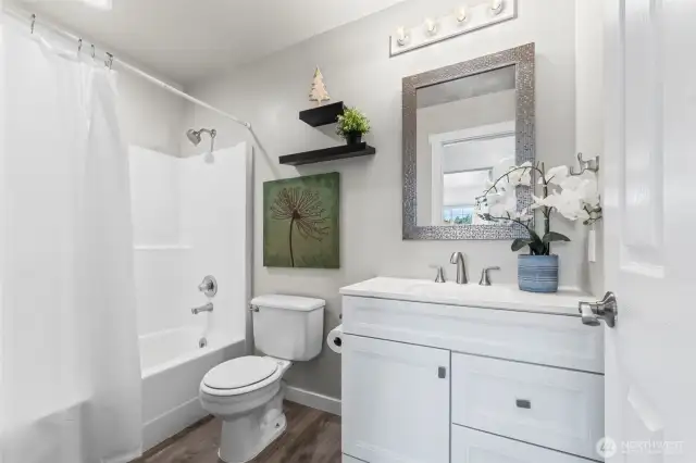 Main bath near additional bedrooms.