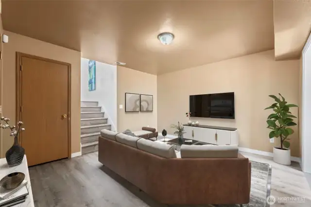 Additional living area down stairs with multiple entry points. (Virtually staged)