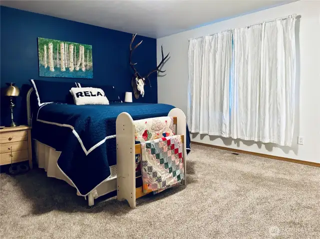 Primary Suite with Full bathroom, walk-in closet views to the back of the property