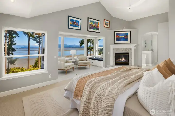 Upper level primary suite with alcove and window seat, perfect for watching the eagles, blue heron's and majestic bay