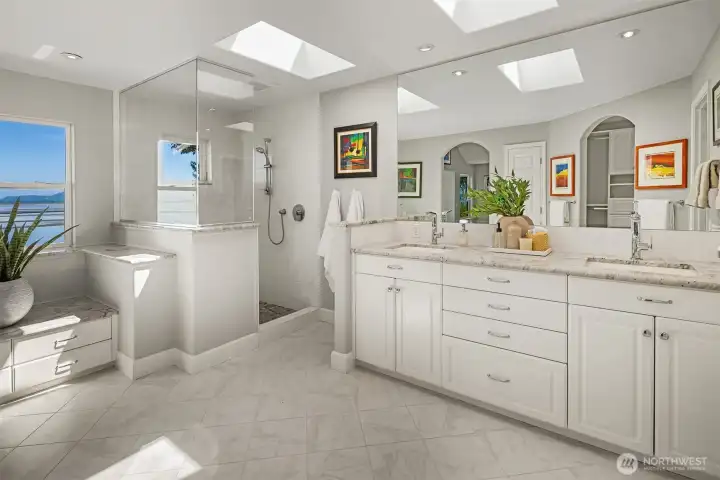 The primary suite has heating floors, dual sinks & walk-in shower