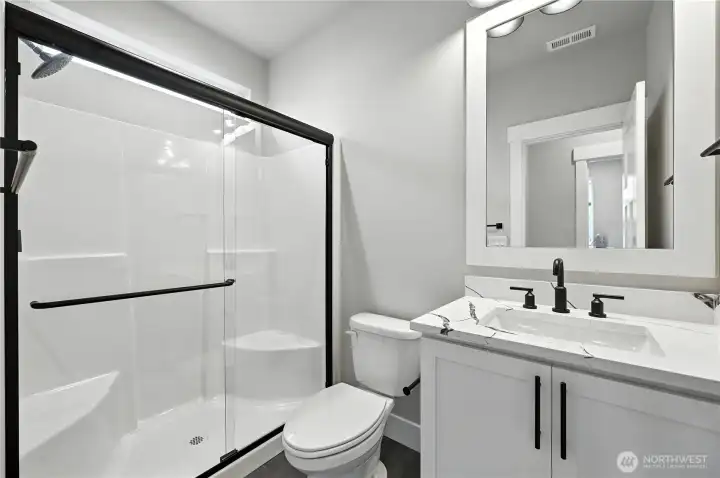 Main Floor 3/4 Bath - photos of same plan built on a different lot. Details will vary