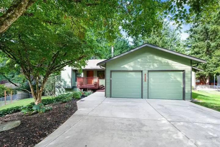 Two car garage and driveway parking for at least 4 vehicles.