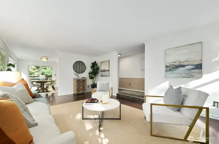 Looking toward the dining room, a view of greenery from every window.