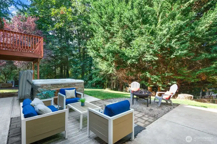 Enjoy the hot tub, fire pit and a beautiful private setting on this patio.