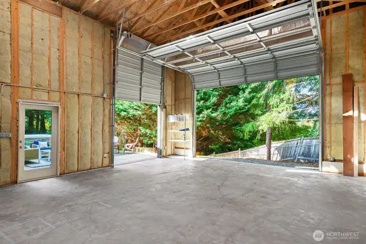 The height of this space is two stories. One could put a floor in and create a very large living addition to the house. It has all been built with permits.