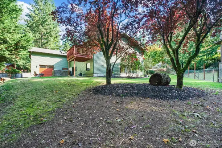Room to play, for pets, and providing a wonderful amount of privacy, this spacious fully fenced yard  feels like a park.