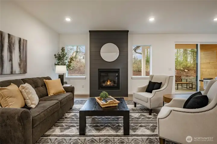 Open Concept Living/Dining Kitchen. Propane fireplace and view to natural habitat.