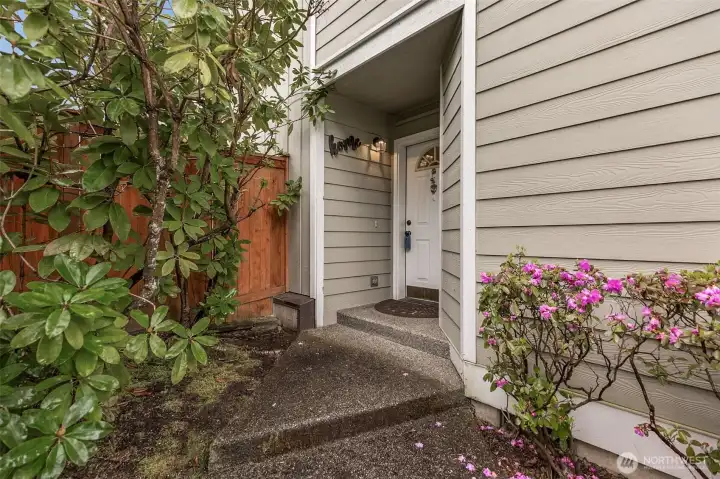 Front door is off to the side of the house from the street.