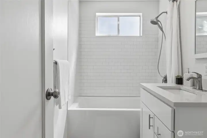 Remodeled main floor hall bathroom with a soaking tub