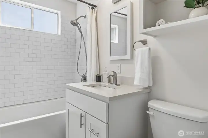 Remodeled main floor hall bathroom with a soaking tub