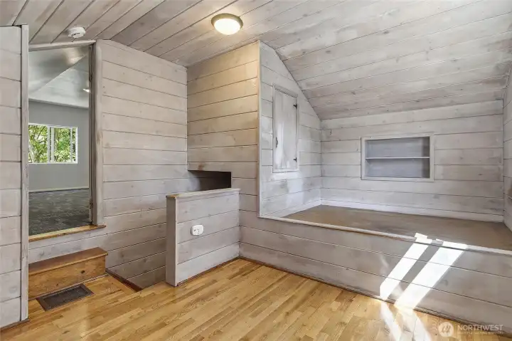 Upstairs "Lovell" floorplan with an open bonus room at the top of the stairs with a built in bed and drawers.