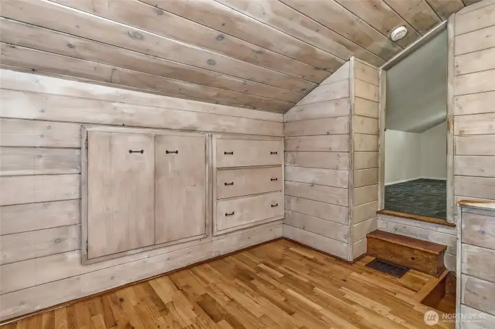 Upstairs "Lovell" floorplan with an open bonus room at the top of the stairs with a built in bed and drawers.