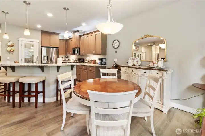 Dining room off the kitchen near the back door with beautiful view of the golf course.