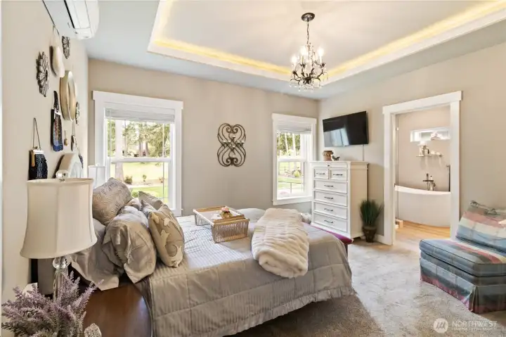 Primary bedroom with cove lighting.