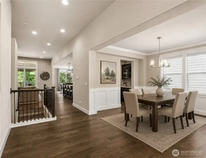 Entry leads to private office and this beautiful dining room space with Butler's pantry opening into kitchen. (Photo Digitally Staged)