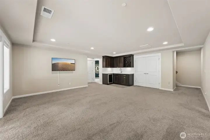 Lower Level Family Room with wet bar is the perfect set up for entertaining!