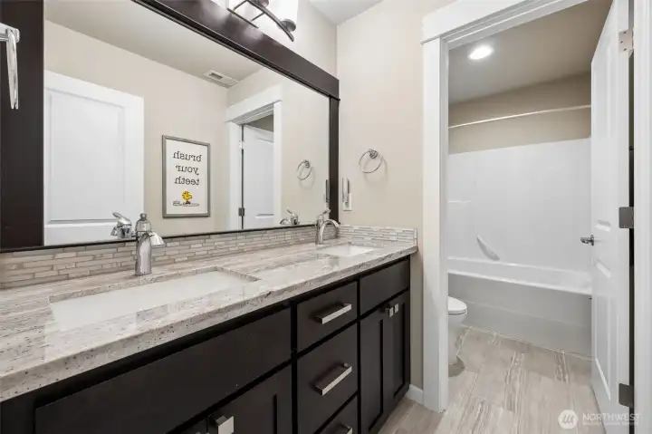 Lower level full bathroom just off bedroom #1 and bonus rec room