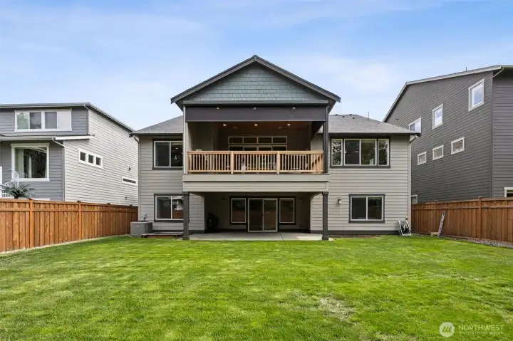 Fully fenced back yard with multiple living/ entertainment spaces