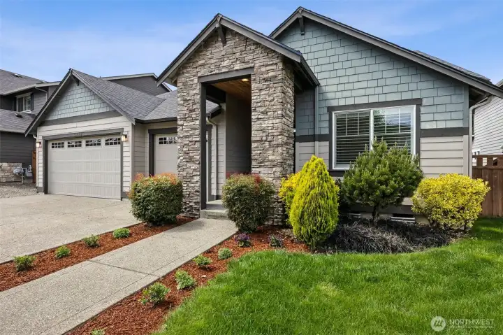 Tasteful landscaping with 3 car garage and additional parking off street