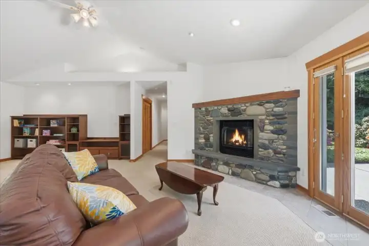 Cozy up to the beautiful stone fireplace.