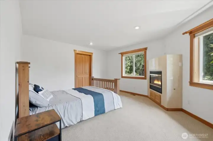 Wind down in the evening in your primary bedroom with a fireplace