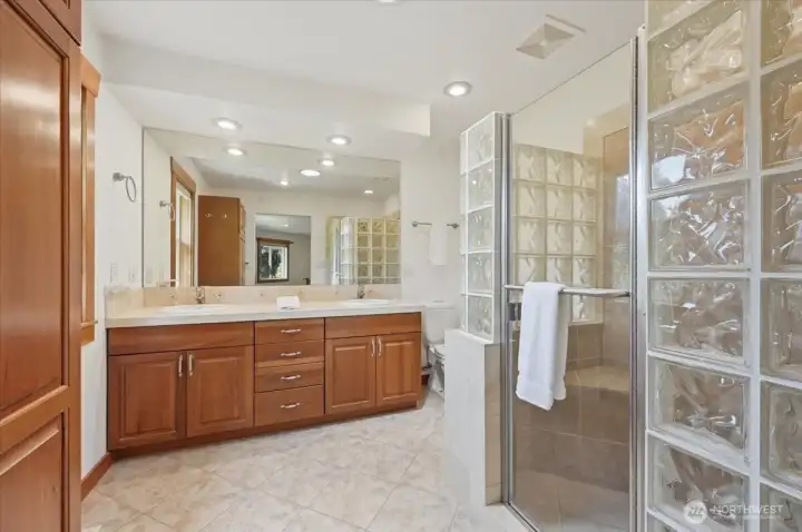 Large glass shower with heated floors in your primary bathroom