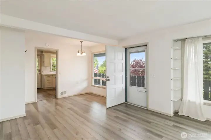 Unit A from living area to dining, deck, kitchen