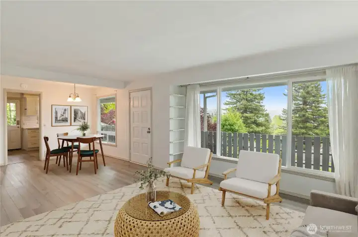 Unit A dining and living areas virtually staged