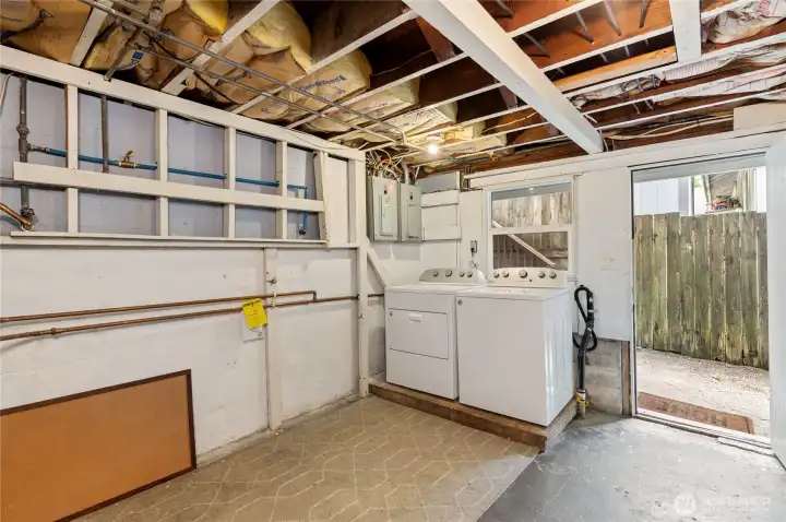 shared laundry showing door to exterior
