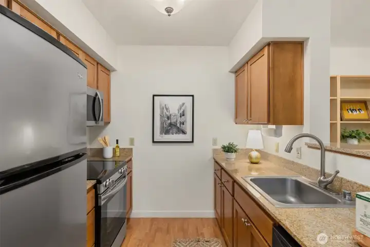 The kitchen is well appointed, featuring granite counters and stainless appliances. The kitchen is well appointed, featuring granite counters and stainless appliances.